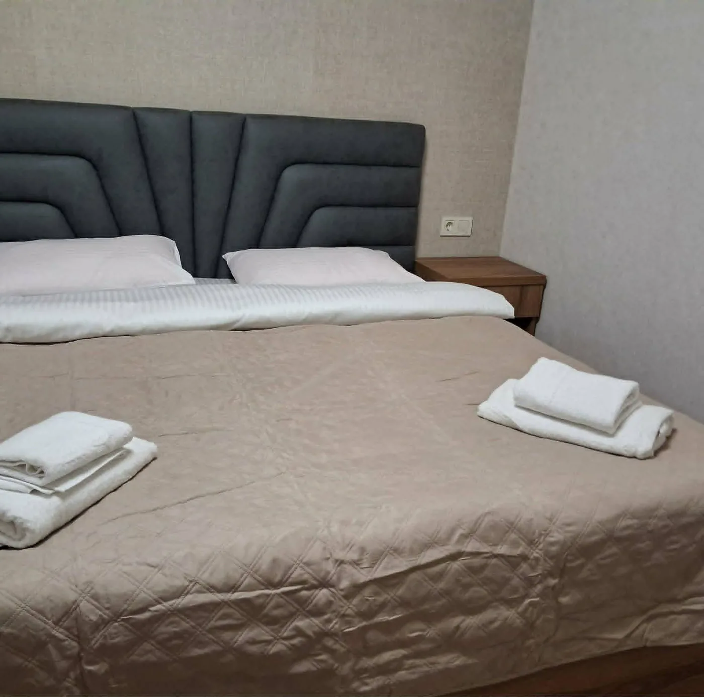Twin room made up with fresh towels at a family guesthouse in Mestia on the Warm Svaneti tour