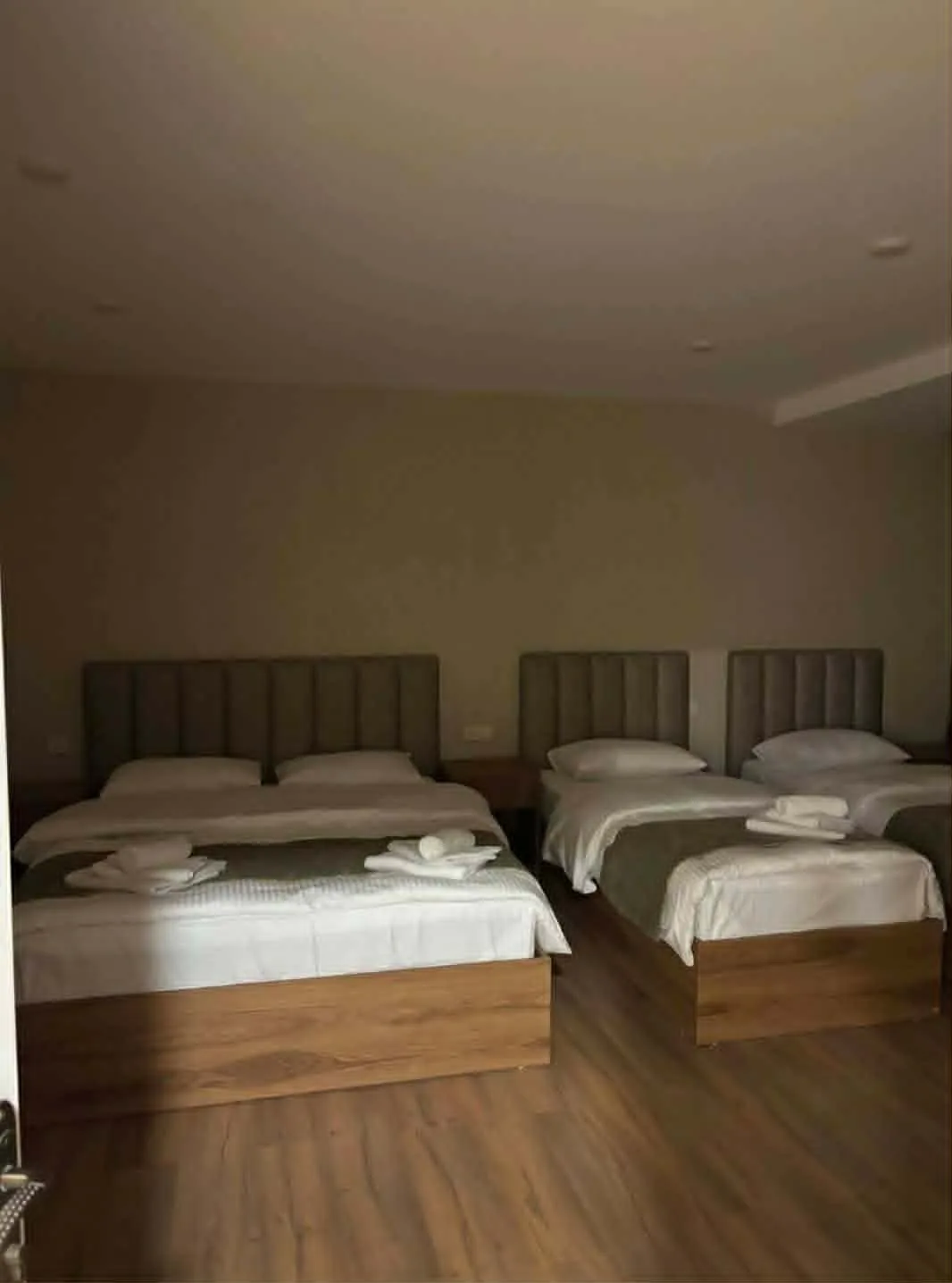 Family room with a double and two single beds, guesthouse in Mestia, Svaneti, Georgia